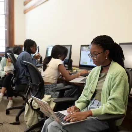 A student on a laptop.